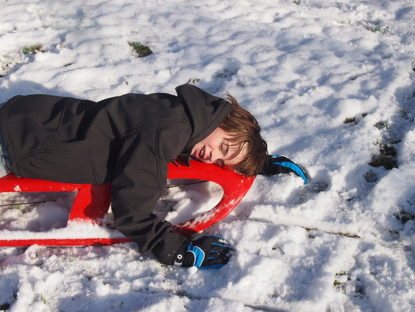 child in the snow wildschooling in a cold climate in winter